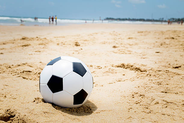 istock Soccer ball on the beach 489123929