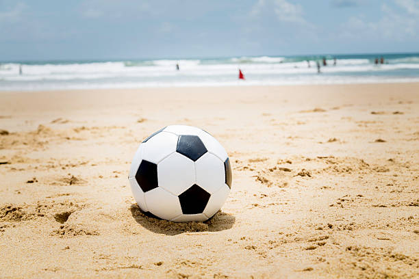 istock Soccer ball on the beach 489123931