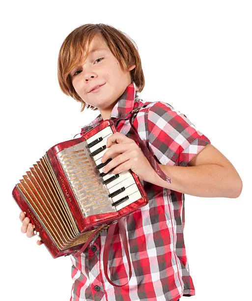 blonde boy playing the accordion