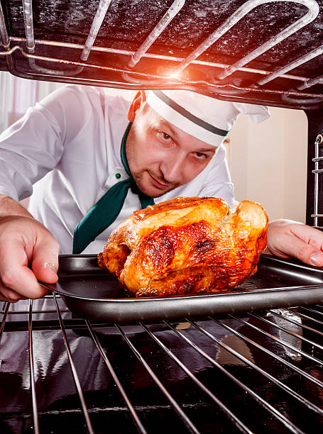 istock Cooking chicken in the oven. 489124276