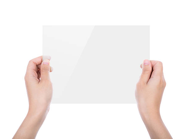 istock Beautiful woman hand holding transparent white device isolated 489124591