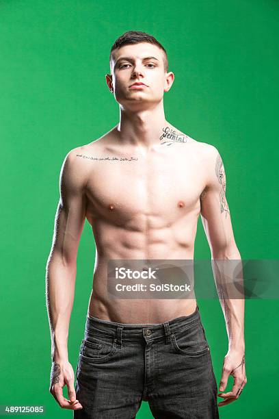 Stressed Teen On A Green Screen Stock Photo - Download Image Now - Boys, Men, Shirtless