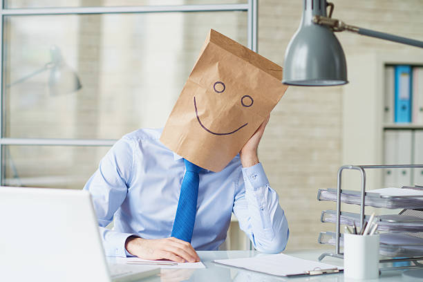 Bored funny businessman Tired businessman trying to conceal emotions by means of paper bag on head anonymous businessman with paper bag on his head stock pictures, royalty-free photos & images