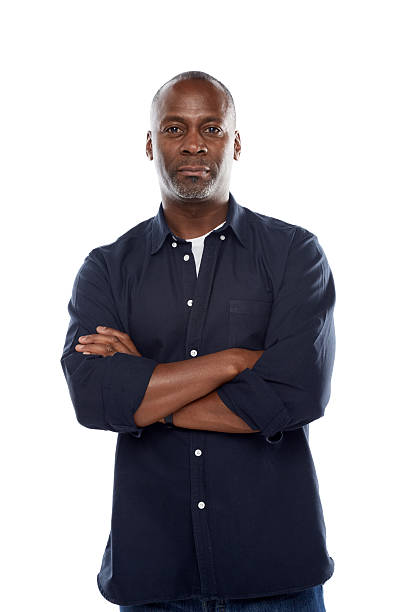 istock Confident mature man standing with his arms crossed on white 489125483