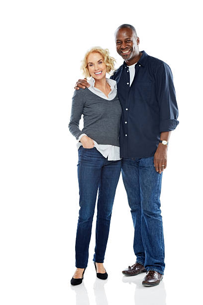 istock Happy mature couple standing together on white 489125511