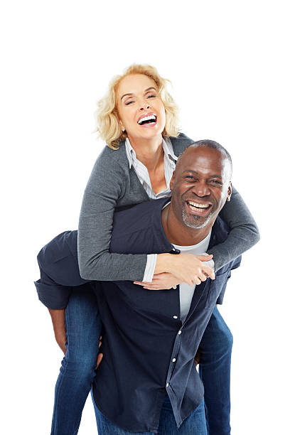 istock Cheerful mature couple having fun together on white 489125531