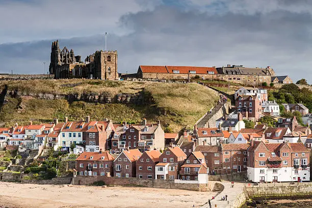 Whitby's famous 199 Steps lead from the town up to the churches of St Mary and the Abbey which dominate the skyline above the harbour