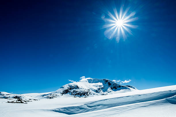 istock Sun and snowy mountain. 489139444