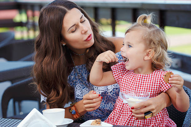 istock Happy mom and daughter eating ice cream 489139818