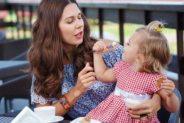 istock Happy mom and daughter eating ice cream 489139864