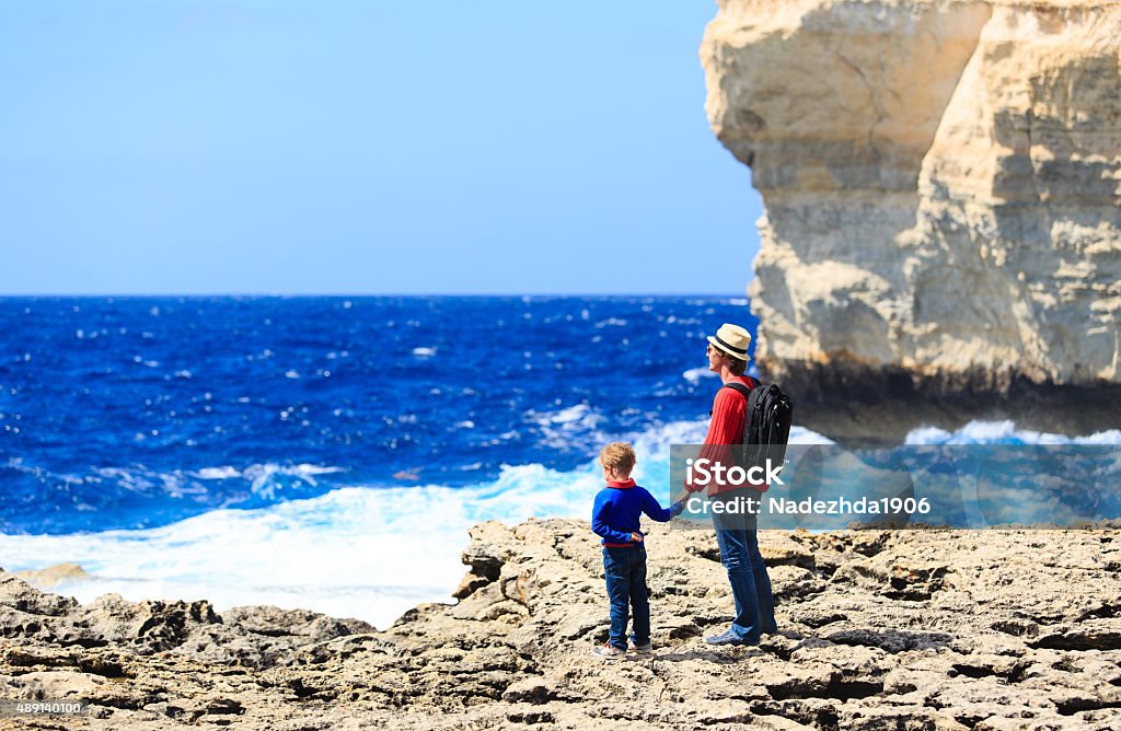 father and son looking at mountains, family travel father and son looking at scenic mountains, family travel 2015 Stock Photo