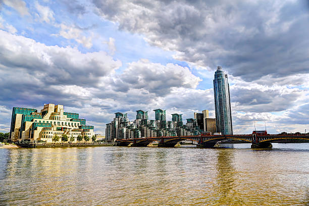 The MI6 building from across the Thames HDR image of the MI6 building from across the river Thames taken on a sunny day.  mi6 stock pictures, royalty-free photos & images