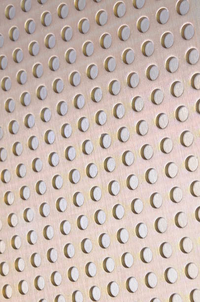 istock Metal background with circular holes 489141464
