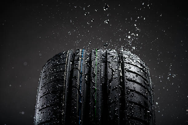 istock Water splashing on tire during the rain 489142172
