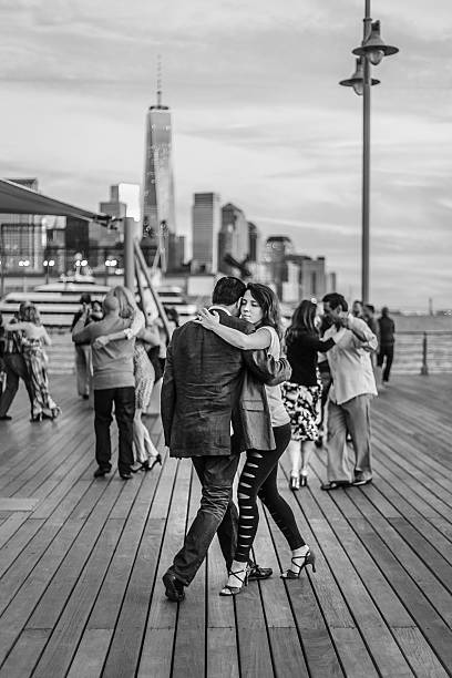 Couple dance tango on a River Hudson pier, NY stock photo