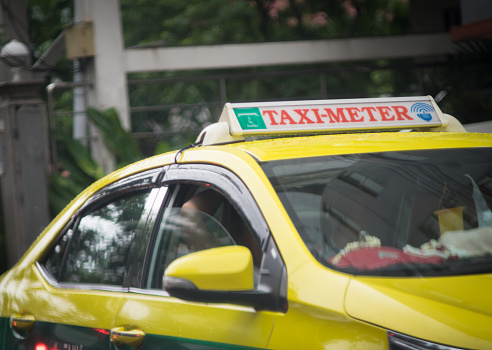 Bangkok, Thailand - September 17, 2015: A taxi driver is sleeping in the traffic jam in Bangkok.