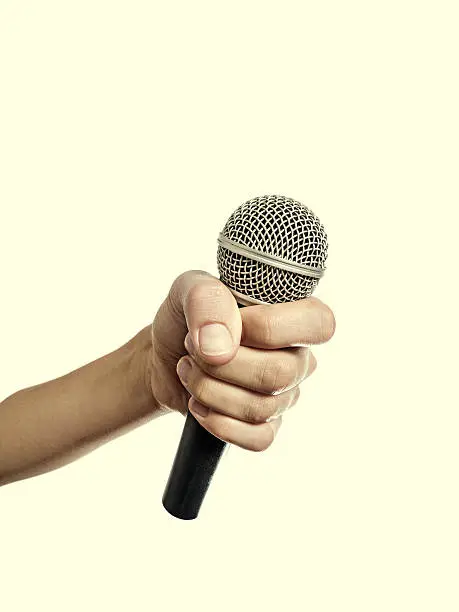 Photo of Hand with microphone