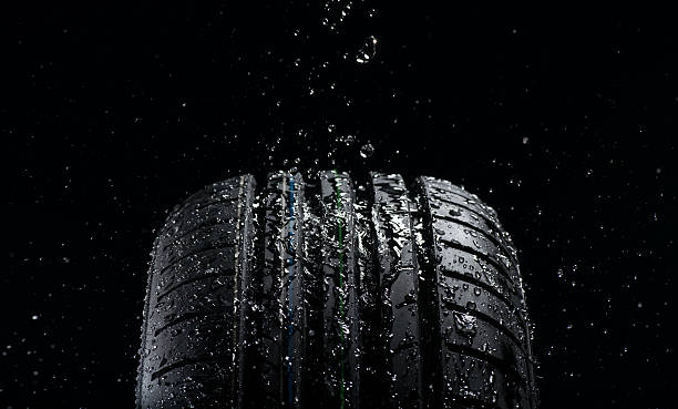 istock Water splashing on tire during the rain 489143172
