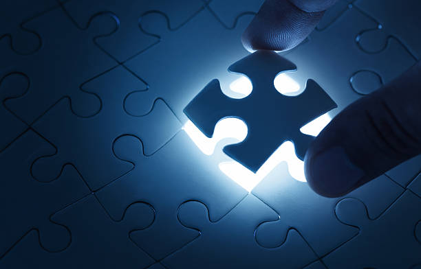 Missing piece Business concept, male hand putting missing piece of jigsaw puzzle with copy space piece of mind stock pictures, royalty-free photos & images