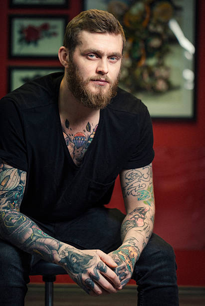 istock Fashionable tattoo artist sitting at studio 489145996