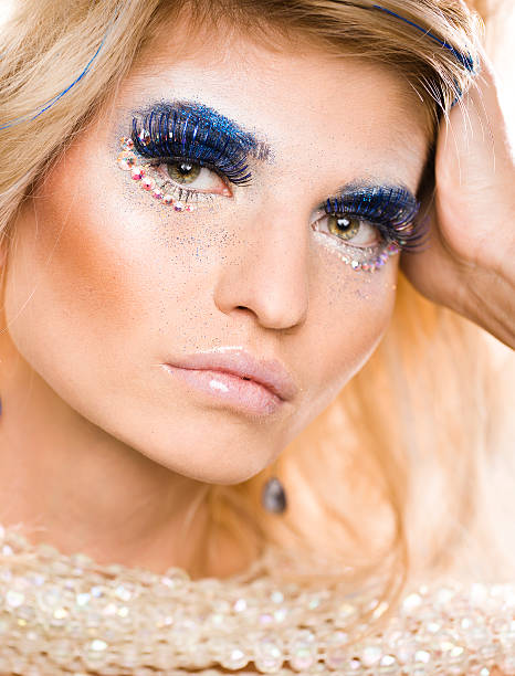istock beauty young woman with creative make up 489146842