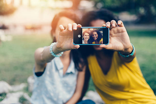 istock Happy girls taking a selfie 489150010