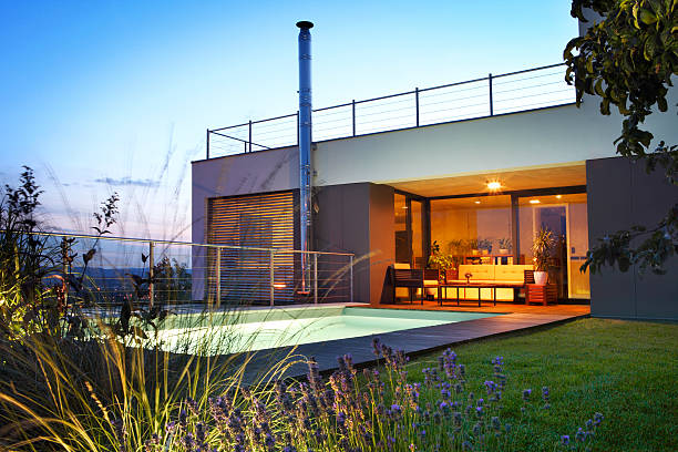 istock Modern house with swimming pool by twilight 489151974