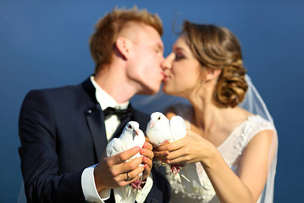istock Wedding couple with pigeons 489152492