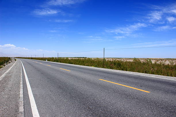 istock Asphalted road and the blue sky 489169688