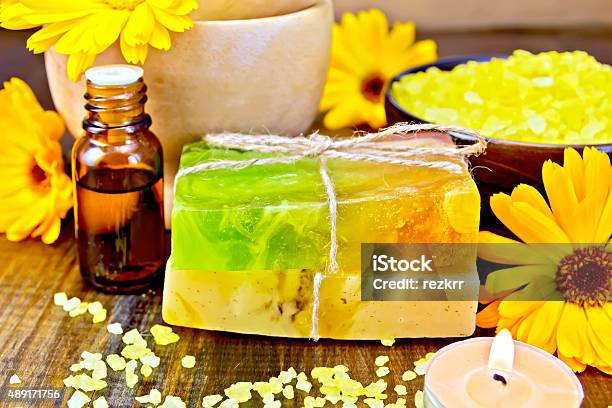 Soap Homemade And Oil With Calendula On Board Stock Photo - Download Image Now - 2015, Beauty Product, Candle