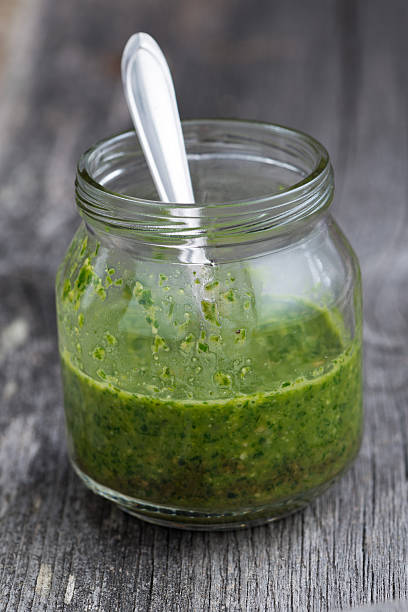 istock pesto in a glass jar 489173282