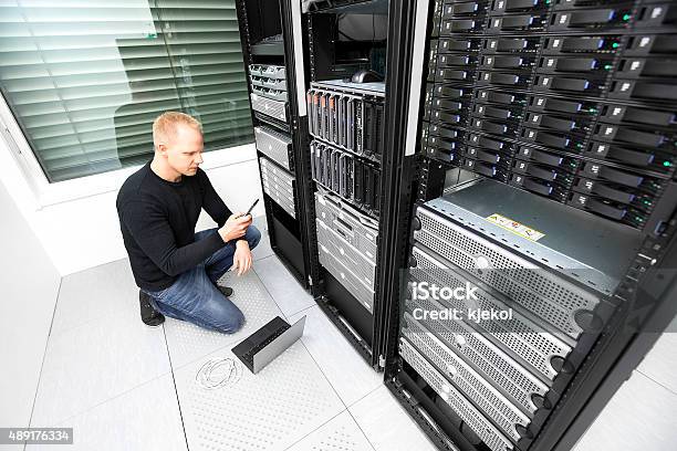 It Consultant Calling For Help In Datacenter Stock Photo - Download Image Now - 2015, Adult, Assistance