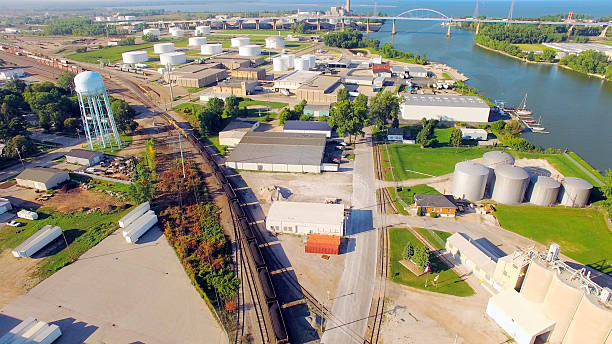 istock Coal Train Rolling Through Scenic Industrial Park, River, Aerial View 489177276