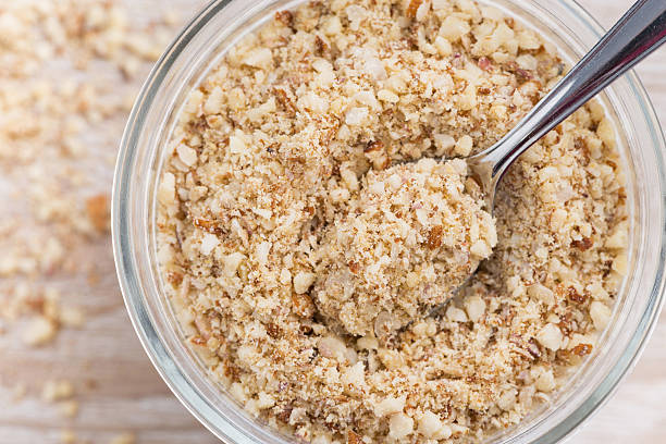 istock ground almonds in a glass jar, top view, closeup 489179136