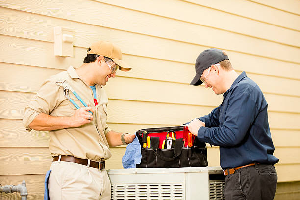 istock Air conditioner repairmen work on home unit. Blue collar workers. 489179886