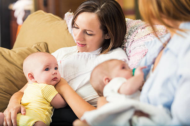 istock Mothers holding babies during breastfeeding support group meeting 489180900