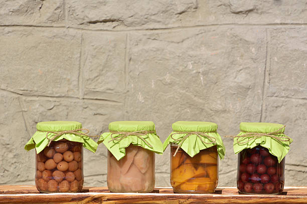 Jars with fruity compotes . Preserved fruits.