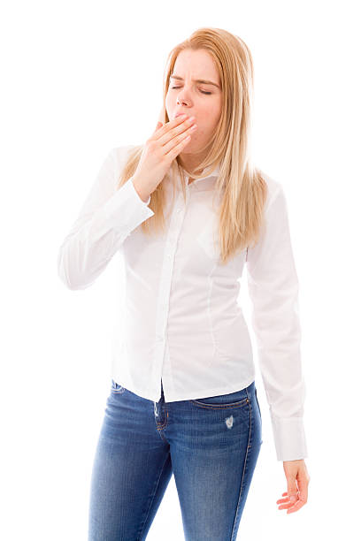 istock Young woman yawning 489189825