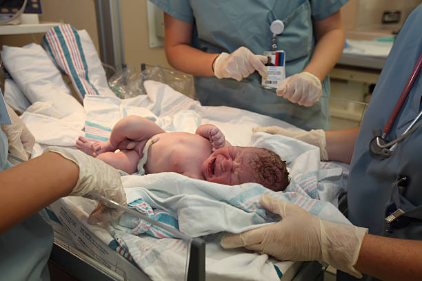 istock Just born baby boy with umbilical cord 489190257