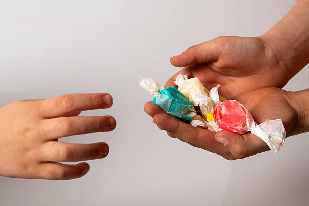 Hands holding candy