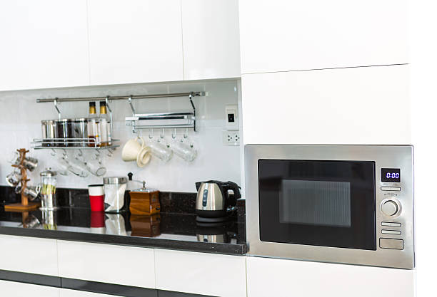 istock Kitchen cabinets with coffee corner in modern home living room. 489191059
