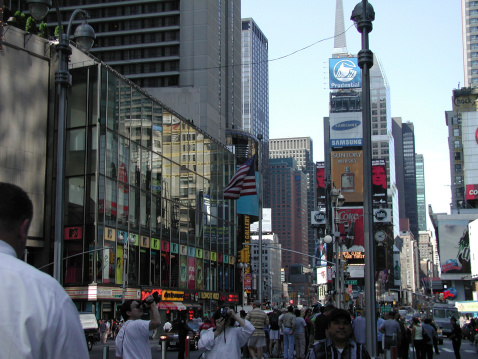 New York City, NY, USA - June 18, 2001: Times Square. People gather in front of MTV studios (left), others take pictures and videos of the area, rest go about their business. 