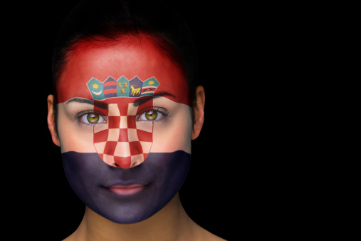 Composite image of croatia football fan in face paint against black