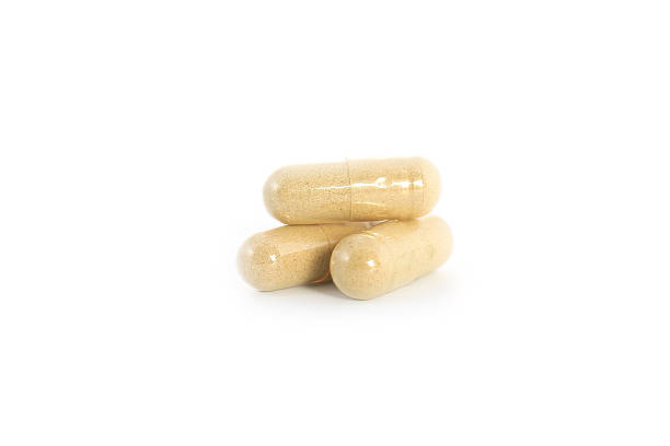 istock closeup of pills isolated on white background 489193399