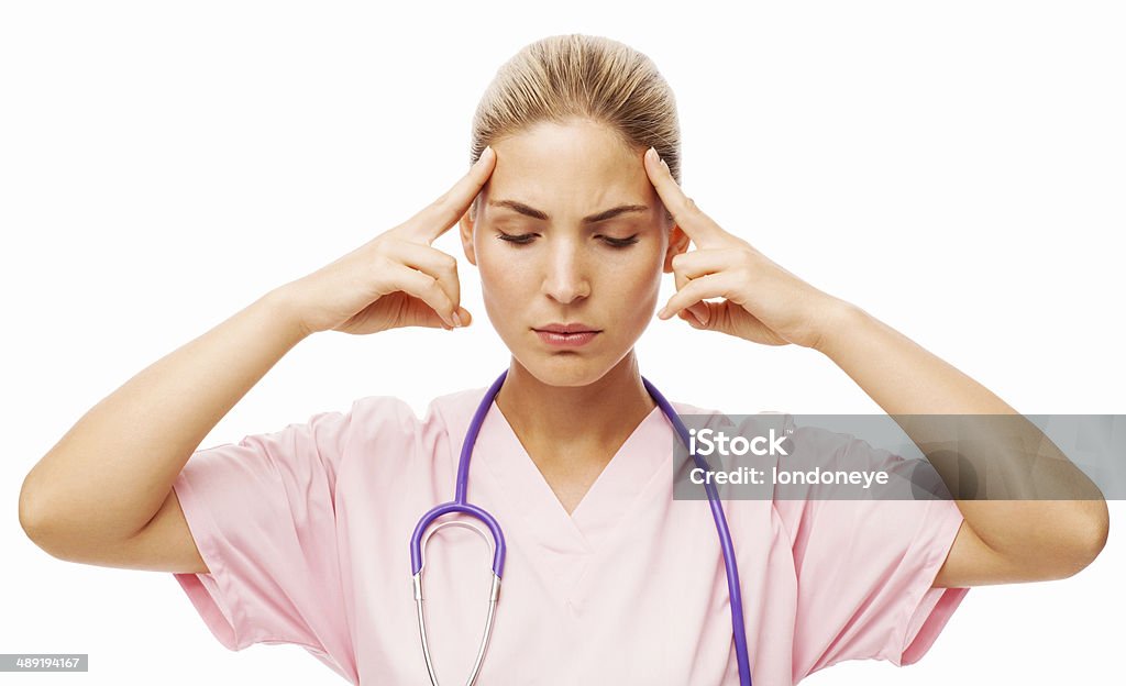 El personal de enfermería que sufren cefalea tocar sus templos - Foto de stock de 20 a 29 años libre de derechos