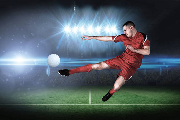 istock Fit football player playing and kicking 489195017