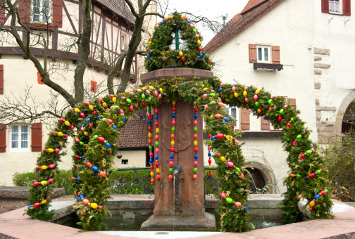 easter fountain. traditional german easter eggs outdoor decoration. Osterbrunnen.