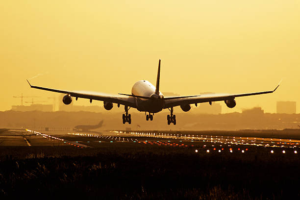 istock Airplane sunrise landing 489197249