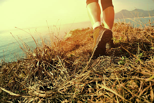 istock hiking feet seaside mountain peak 489197643