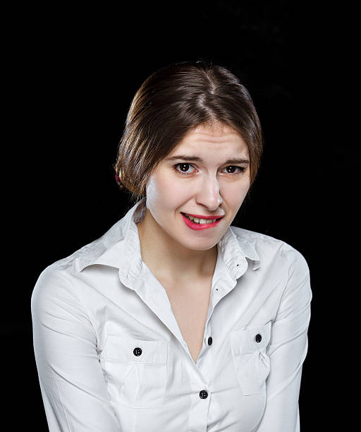 istock Young casual woman isolated over black background 489201214